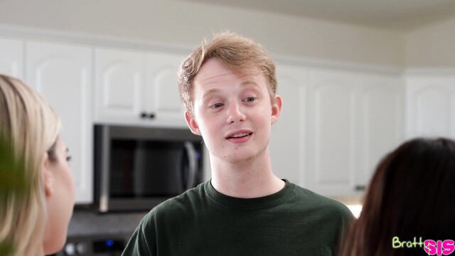 Freckled teen guy chats with two stepsisters in kitchen threesome preview