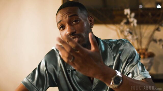 Hollywood Cash in silk shirt gesturing seductively