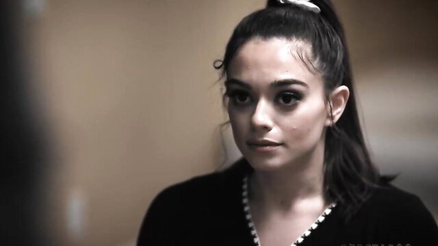 Sophia Burns closeup in sexy black dress, taboo stare