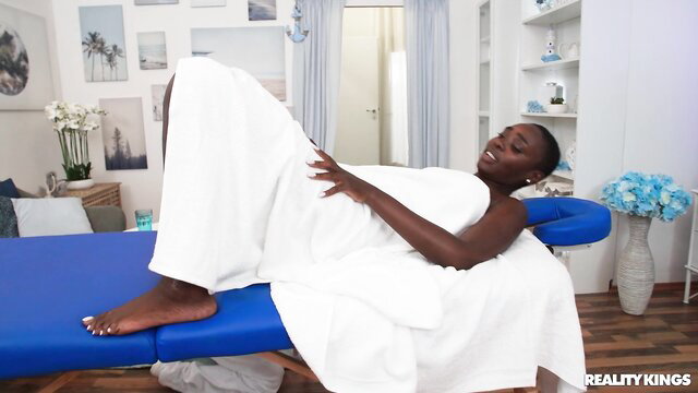 Zaawaadi nude on massage table in Reality Kings scene