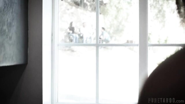 Gia Paige peeking through window in seductive Adult Time threesome tease