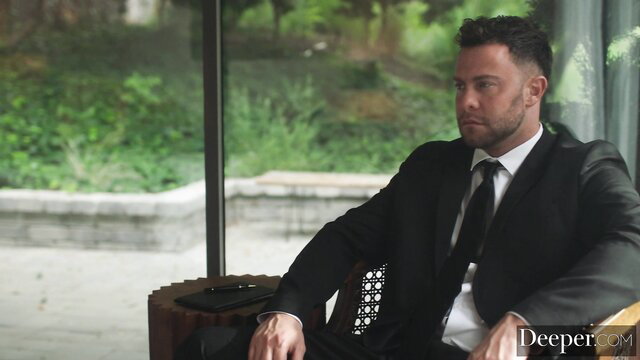 Cherry Kiss in suit sits pensively in Tushy threesome preview