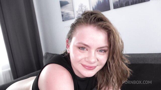 Lesya Milk smiling seductively in tight black top, wet hair