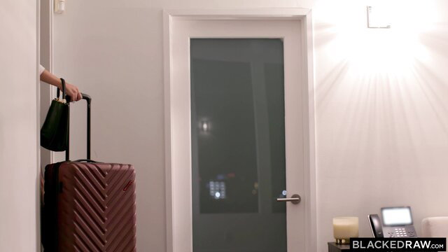 Jamie Knoxx with suitcase by door in Blacked interracial scene
