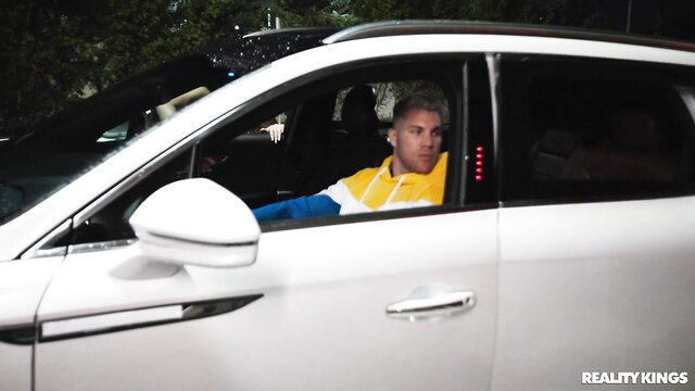 Blond guy in hoodie in white luxury SUV at Miami party - Reality Kings