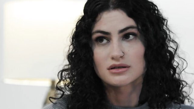 Curvy brunette in gray sweater, seductive gaze in threesome tease