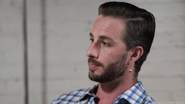 Handsome bearded Lucas Frost in checkered shirt, closeup profile
