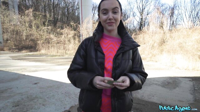 Zoe Doll in leather jacket smiling outdoors - Public Agent