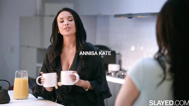 Anissa Kate in sexy black robe serves coffee in kitchen tease