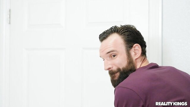 Bearded man peeks from door in Cali Caliente Nicole Kitt Reality Kings scene