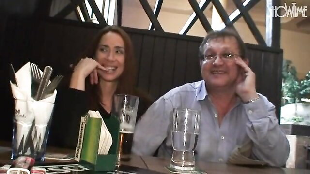Pepper Pew and Thomas Vergen smiling intimately at pub table