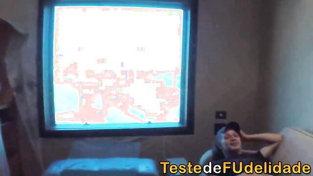 Behind-the-scenes Brazilian porn with woman by window, man lounging