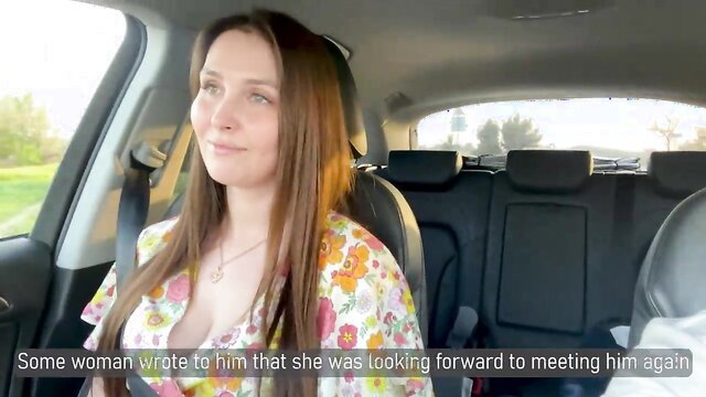 Brunette stepmom in floral dress smiles in car, texts stepson meetup