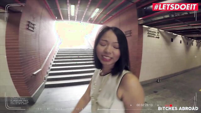 Jureka del Mar smiling in tunnel, sexy Asian teen tourist in white dress