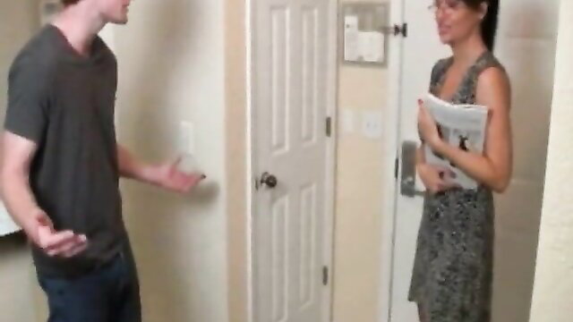 Angie Noir spex cougar in dress talking to guy at door POV