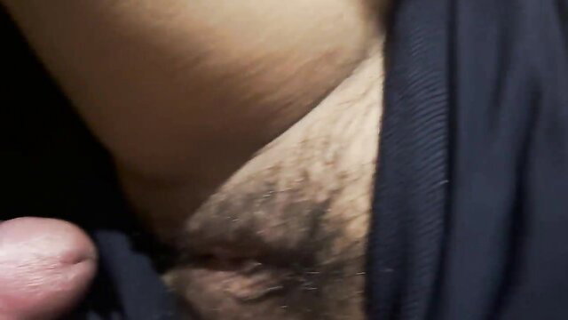 Closeup of Thai man's erect cock and hairy pubes pulling out of tight pussy