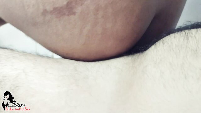 Dark-hued Sri Lankan big tits babe straddling hairy man's lap in Sinhala amateur sex