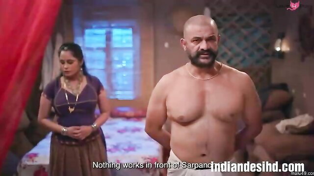 Bald Indian man shirtless with curvaceous Desi MILF ex-wife in bedroom