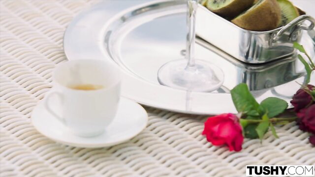 Eyla Moore with coffee, wine, kiwi & roses on elegant tray
