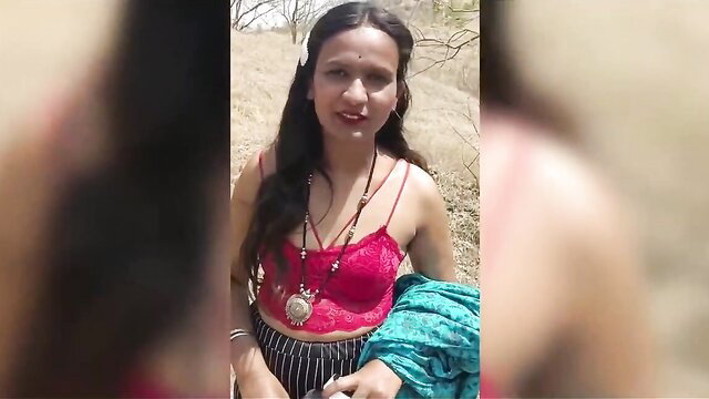 Indian stepmom in red lace bra and striped pants posing wild in jungle