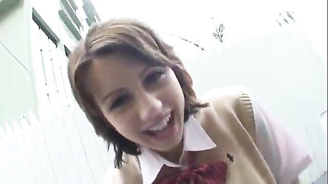 Lexi Belle smiling in sexy schoolgirl uniform