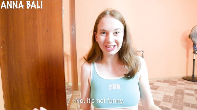 Innocent Anna Bali in tight tank top, smirking playfully