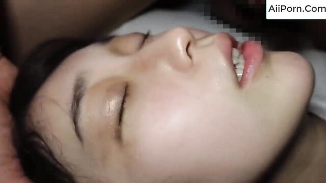 Petite Japanese teen's face in ecstasy during hotel threesome