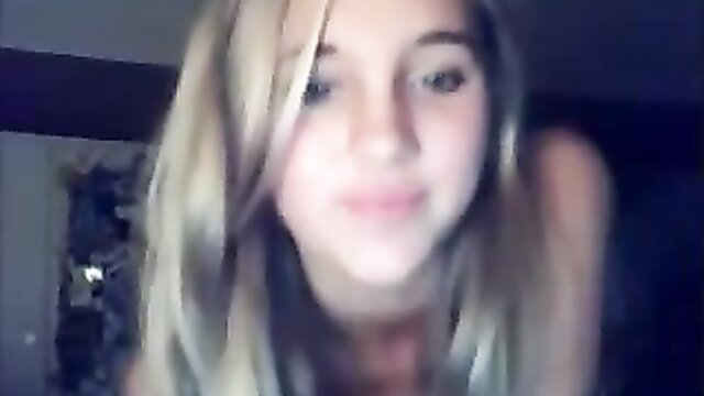 Blonde teen smiling on webcam, stripping tease