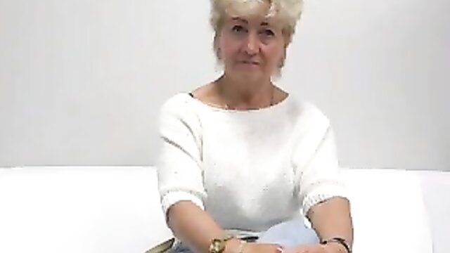 Blonde Czech MILF in white sweater on couch, perfect breasts