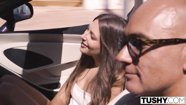 Talia Mint smiling in car with Christian Clay, Tushy outdoor tease