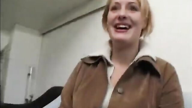 Chubby mature blonde in fur collar jacket smiles in revealing interview