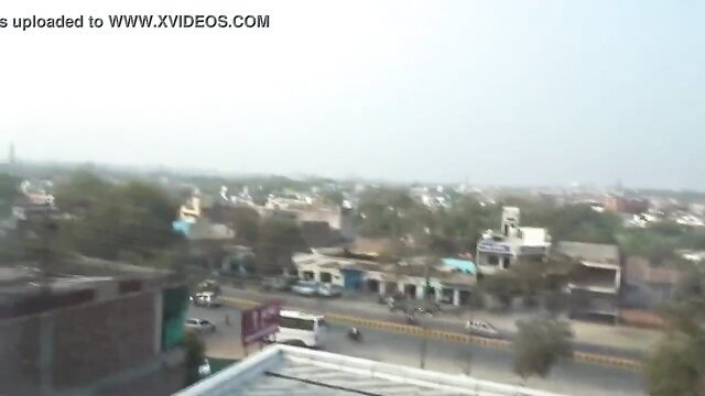 Indian city skyline view from rooftop, sunny day urban scene