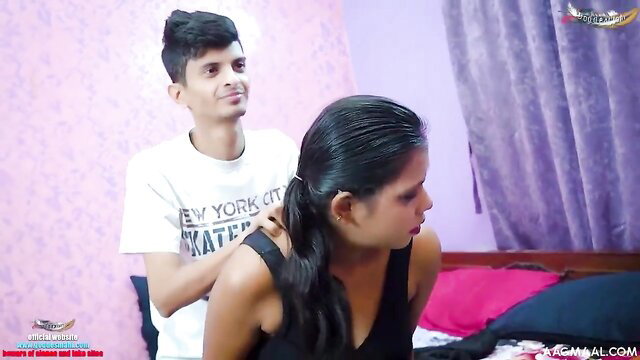 Indian teen guy massaging busty girl's shoulders in tight top
