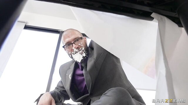 Bald man in suit with cum on glasses and face from Brazzers
