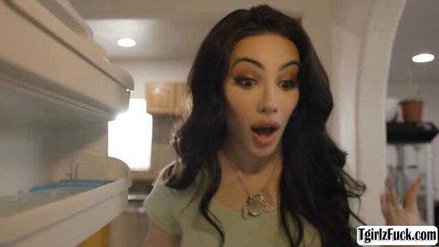 Syren De Mer shocked expression in green top, hot brunette milf