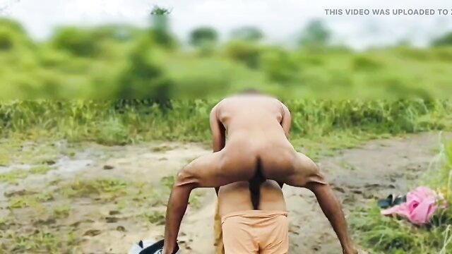 Naked Indian man in outdoor butt-up pose with clothed boy
