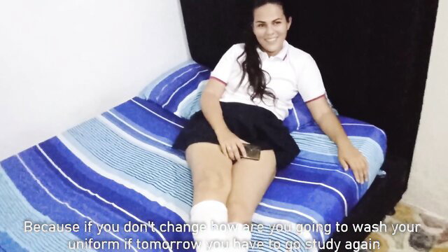 Latina teen in school uniform on bed, legs spread, amateur tease