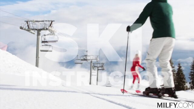 Ski instructor MILF in tight white pants teaches hot redhead on snowy slope