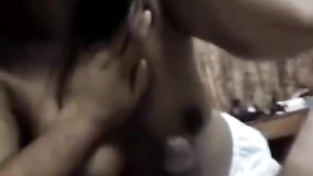 Indian cutie with hand on neck in closeup adult scene