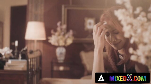 Redhead beauty in elegant bedroom, soft tease pose