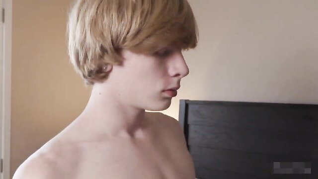 Hot young blonde twink shirtless profile view in bedroom