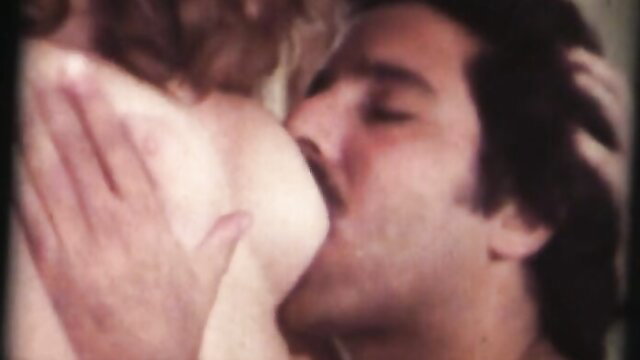 Ron Jeremy kissing Chrissy Beauchamp's tits in vintage kinky porn