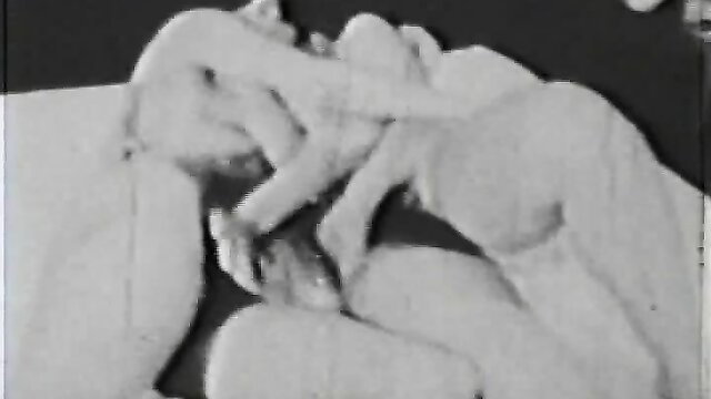 Vintage B&W lesbian scissoring with small natural tits, hairy pussies