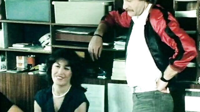 Vintage German porn: horny wife smiles at mustached husband in office