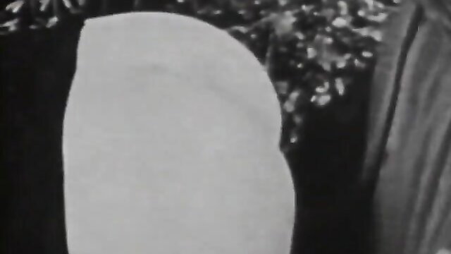 Vintage retro porn thumbnail: nude woman with big tits and bush in bushy outdoors