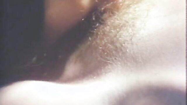 Blurry closeup of bearded man's neck and hairy chest in wild outdoor classic porn