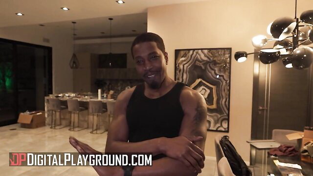 Muscular black man flexing shirtless in luxurious home BTS