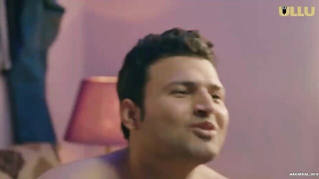 Handsome Indian man smirking shirtless in Ullu adult scene