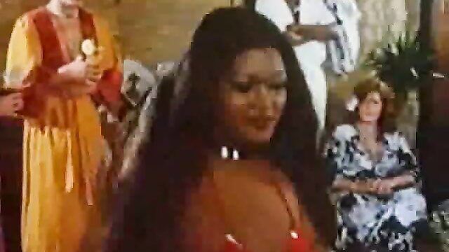 Long-haired German babe in orange dress with busty black and blonde friends