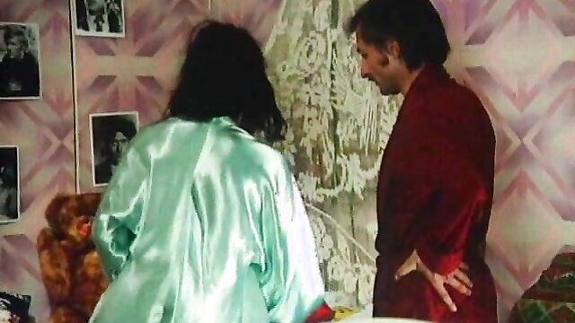 Retro German couple in silky robes, man groping woman from behind